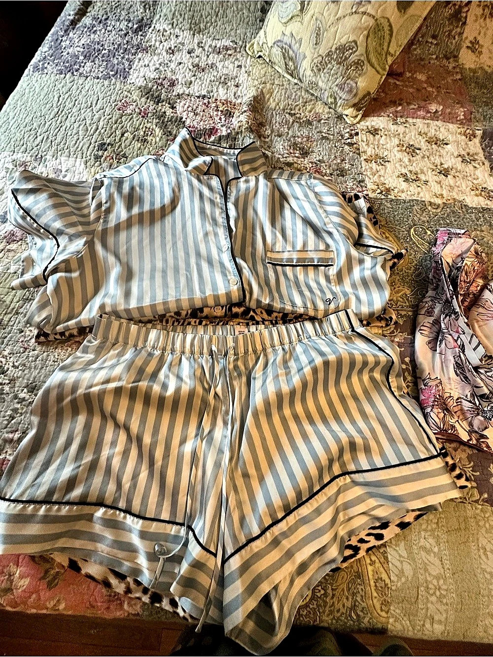 Three pairs of Victoria Secret satin short pj sets.